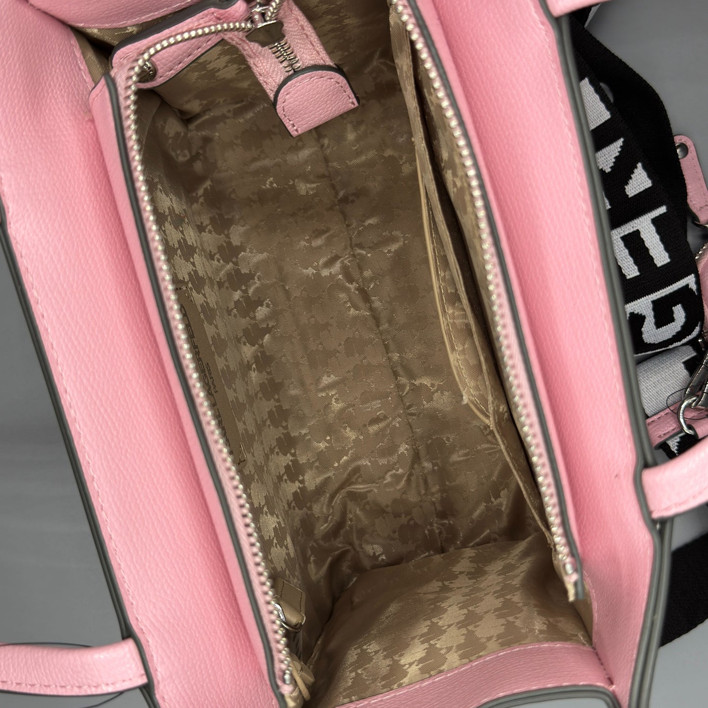 Pink bag with camouflage lining on a gray background karl lagerfeld satchel