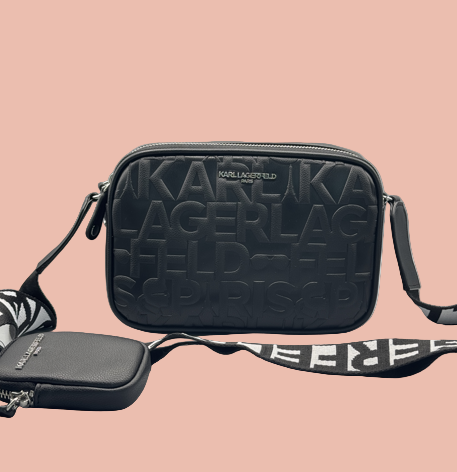 Black Karl Lagerfeld bag with brand embossing on a gray background