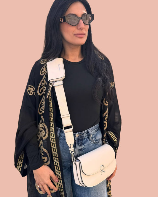 Calvin Klein crossbody features a sleek flap design