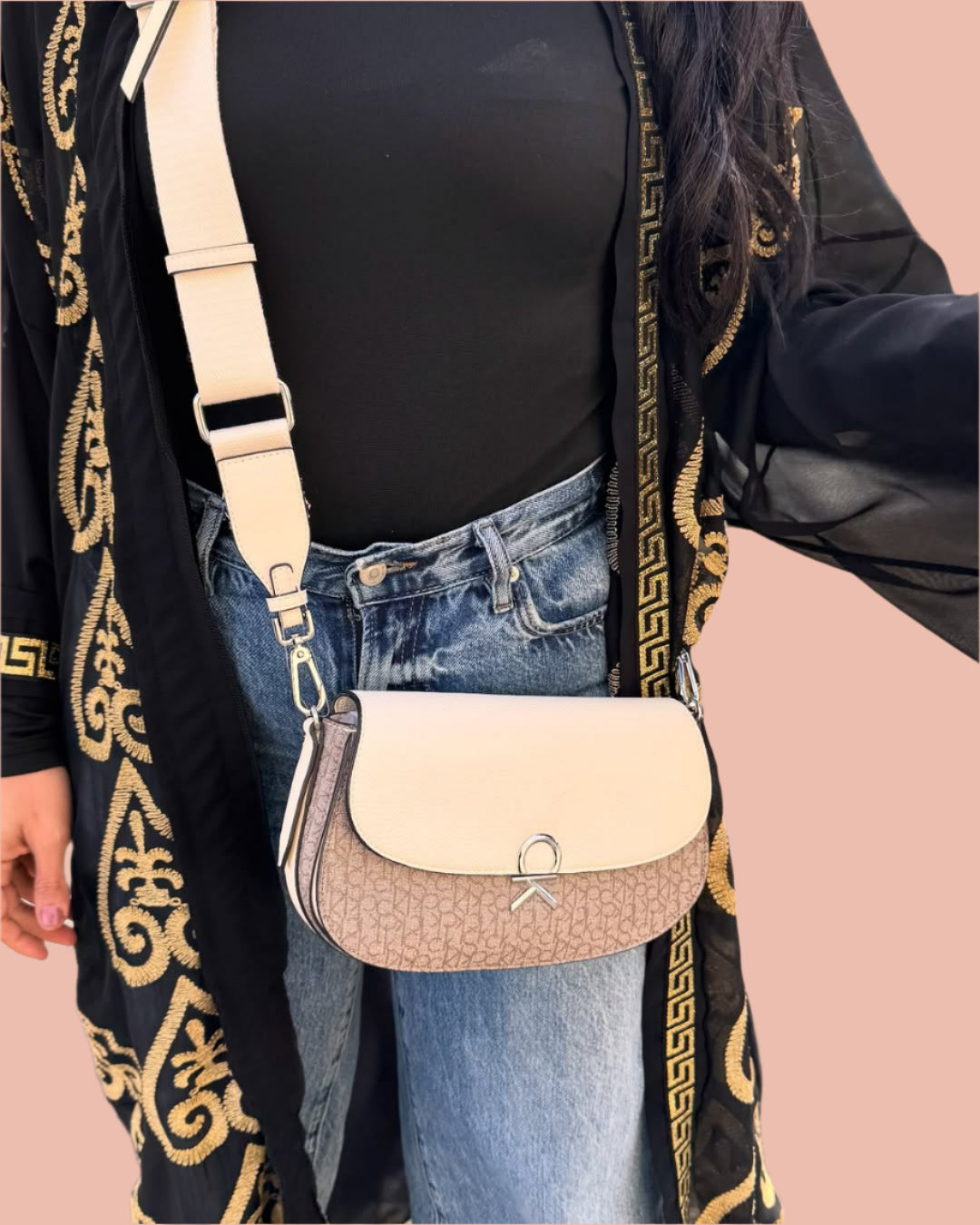 Calvin Klein crossbody features a sleek flap design