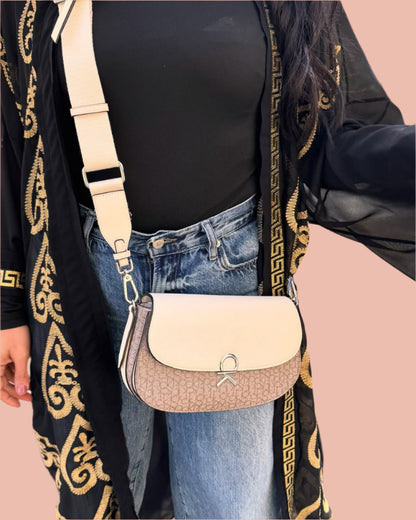 Calvin Klein crossbody features a sleek flap design