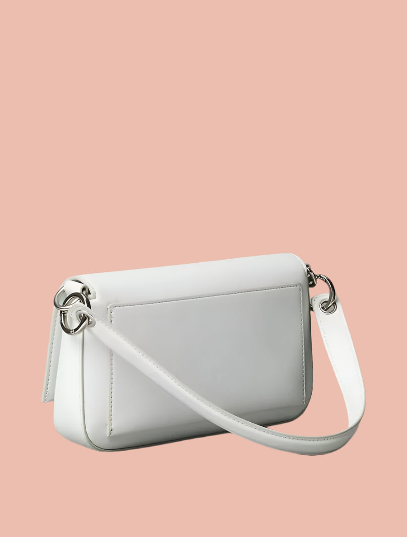 White handbag with a strap on a beige background