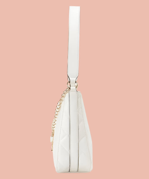 White handbag with a gold chain on a white background