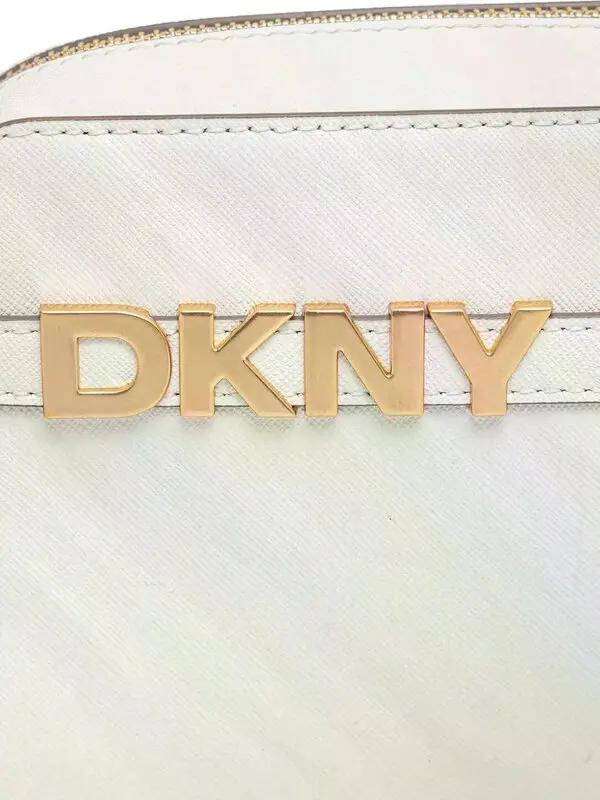 White handbag with gold 'DKNY' logo on a white background
