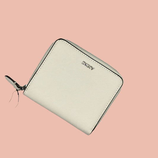 White wallet with a brand tag on a gray background