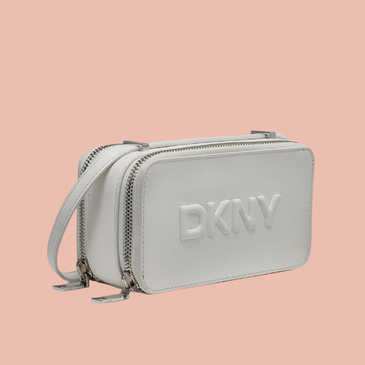 Silver DKNY handbag on a white background