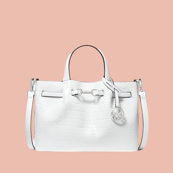 White handbag with a handle and strap on a white background