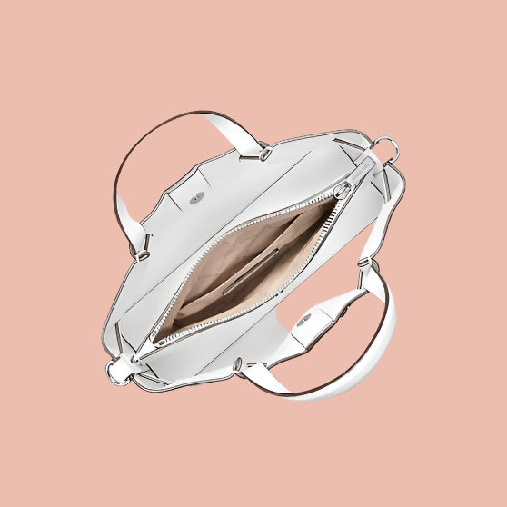 Silver handbag with open front compartment on a white background