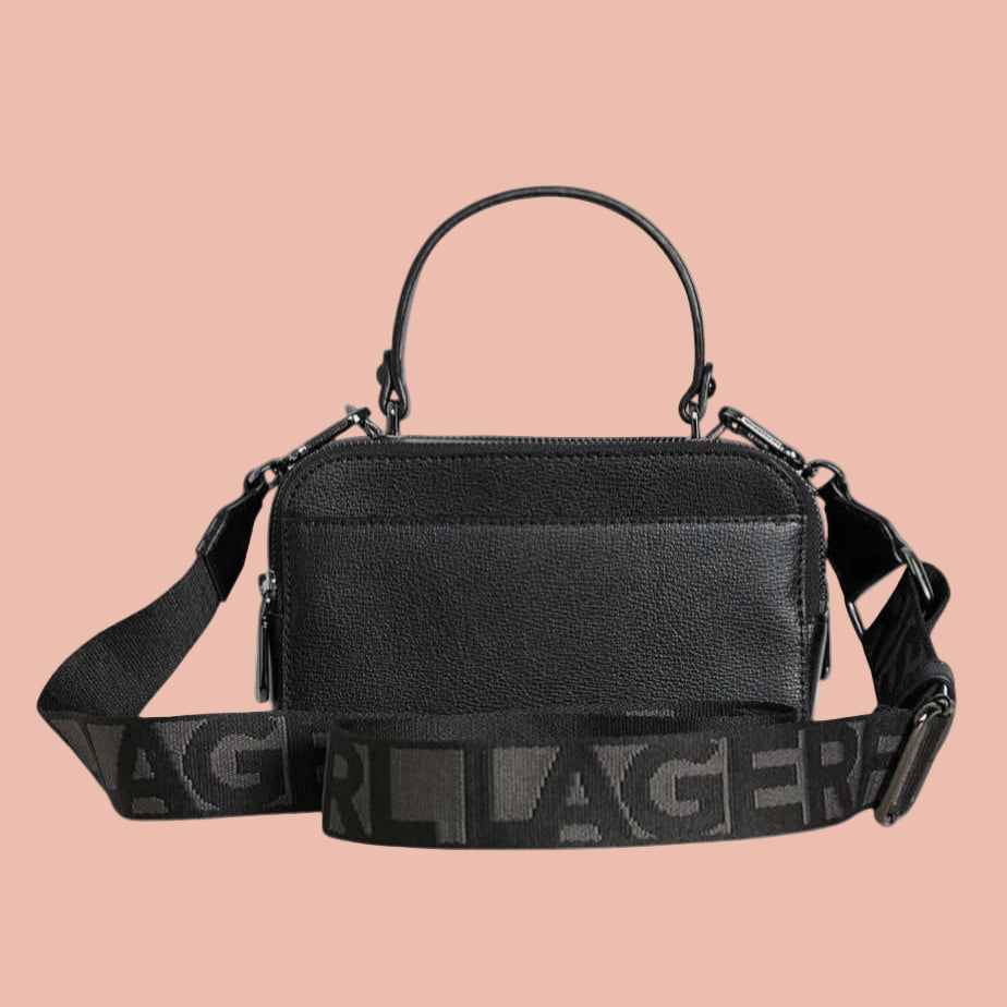 Black handbag with a visible brand logo on a white background